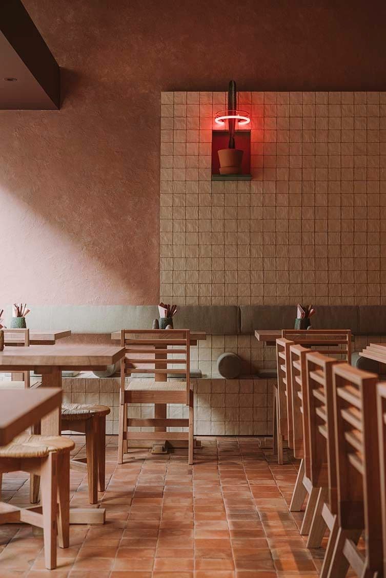 Café with terracotta walls and wooden furniture