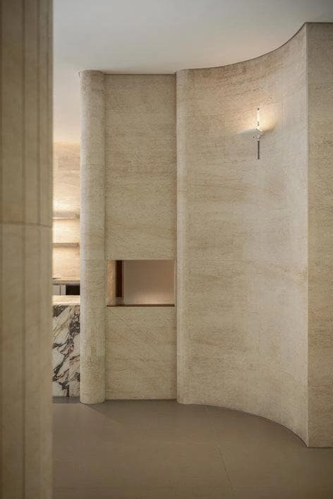 Travertine shower with curved walls
